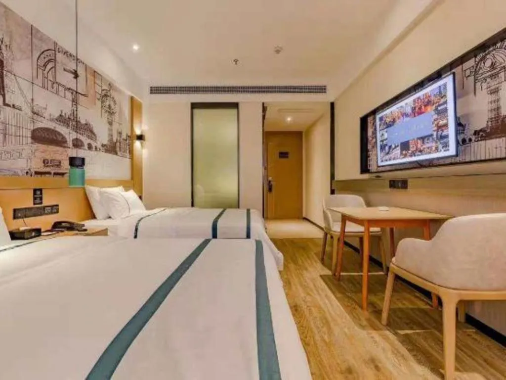 Bed in City Comfort Inn Meishan Wanda Plaza