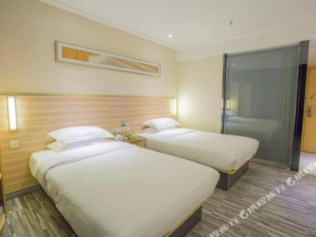 Bed in City Comfort Inn Hechi Bama Shouxiang Avenue