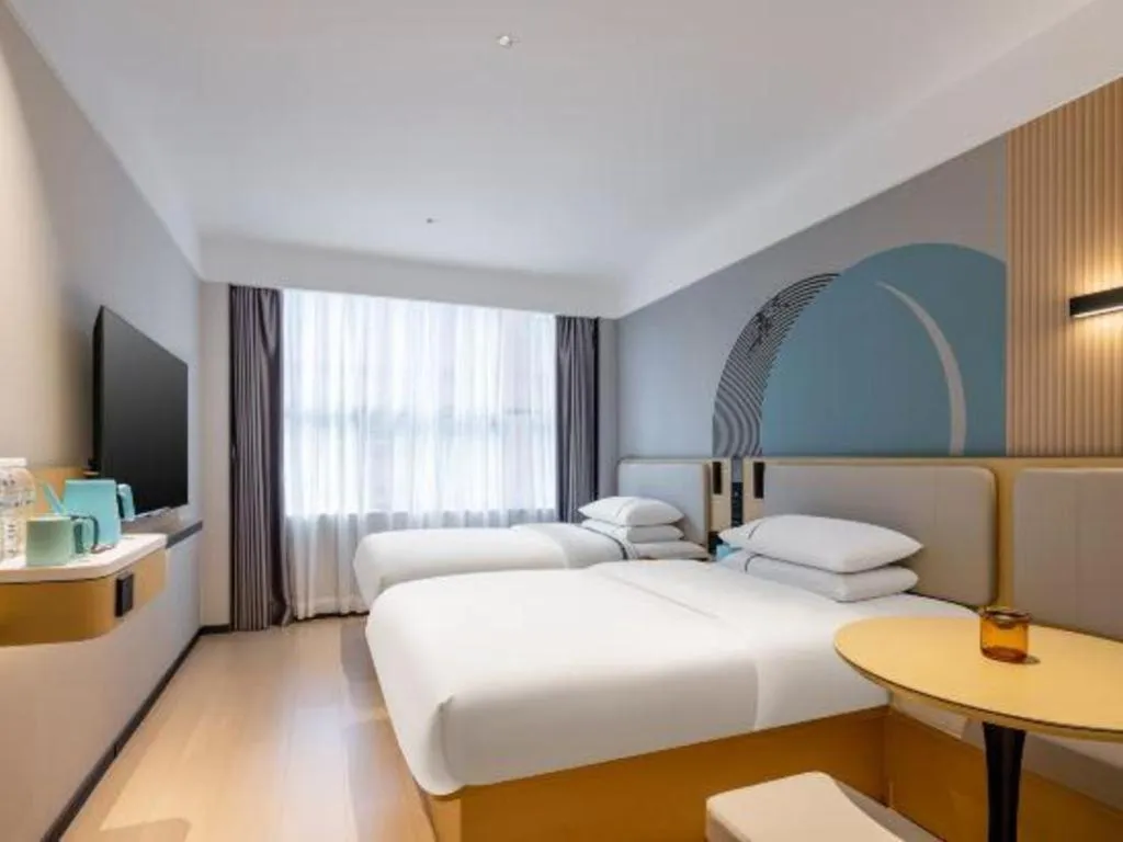 Bed in City Comfort Inn Hechi Bama Shouxiang Avenue