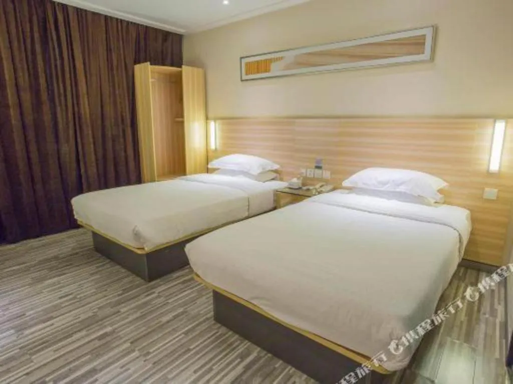 Bed in City Comfort Inn Hechi Bama Shouxiang Avenue