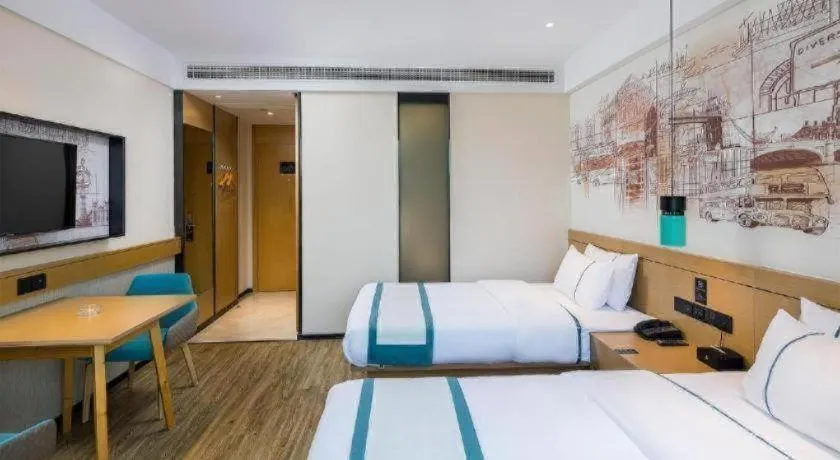 Bed in City Comfort Inn Taizhou Wanda Plaza