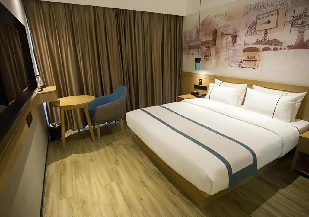 Bed in City Comfort Inn Taizhou Wanda Plaza
