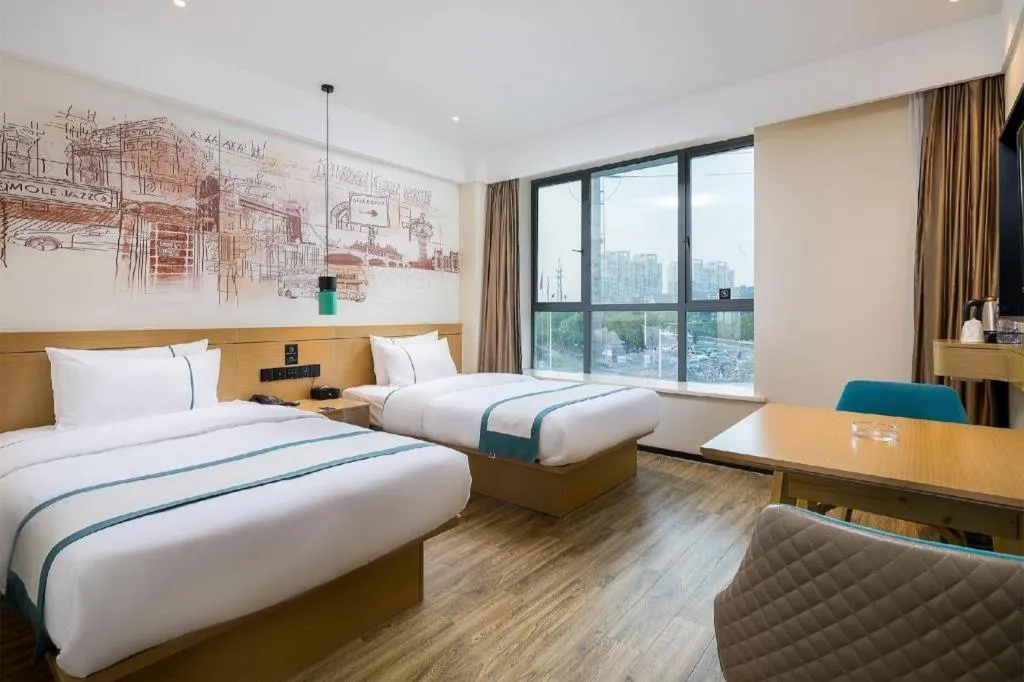 Bed in City Comfort Inn Taizhou Wanda Plaza