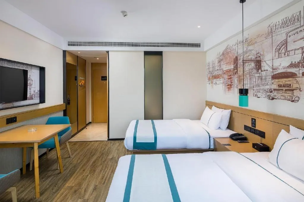 Bed in City Comfort Inn Taizhou Wanda Plaza