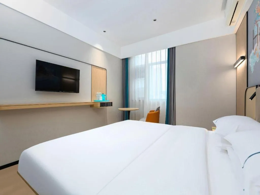 Bed in City Comfort Inn Wuhan International Expo Center Qianjin Village Metro Station