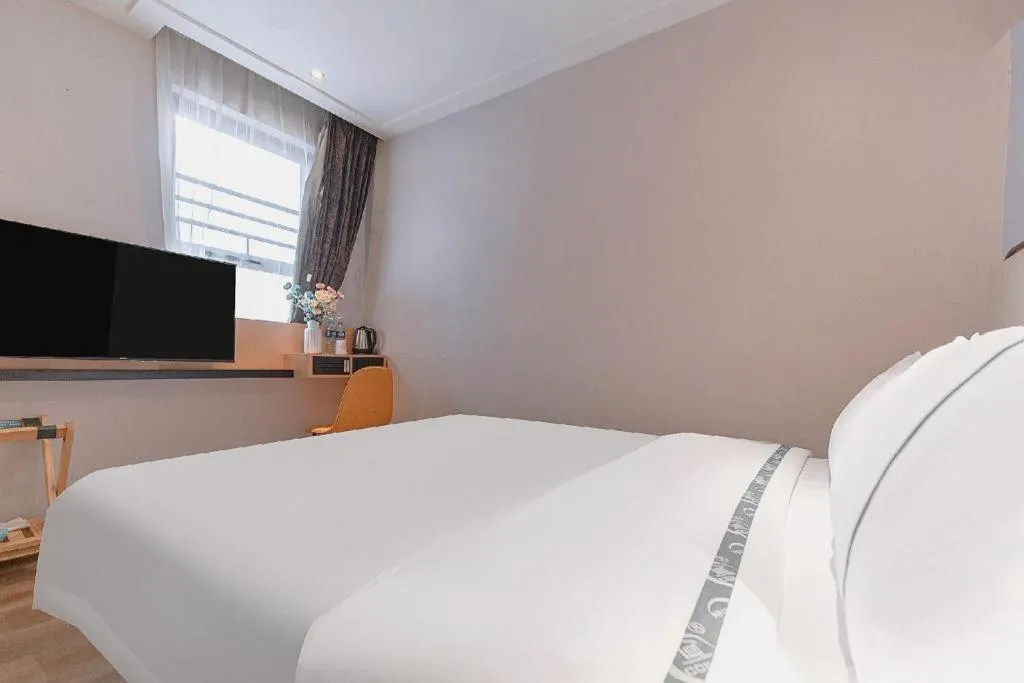 Bed in City Comfort Inn Liuzhou High-speed Railway Station