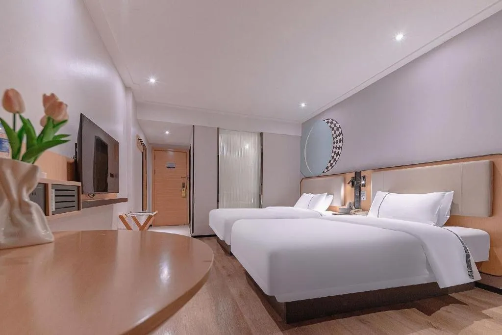 Bed in City Comfort Inn Liuzhou High-speed Railway Station