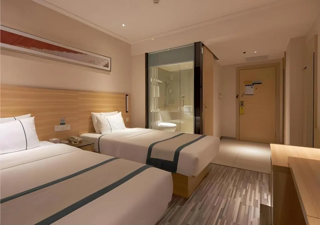 Bed in City Comfort Inn Liuzhou Wuxing Walking Street