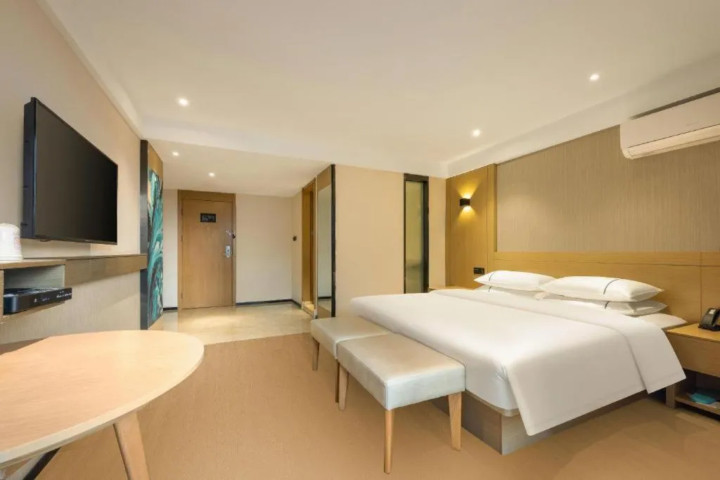 Bed in City Comfort Inn Liuzhou Wuxing Walking Street Zhonghuan Tower