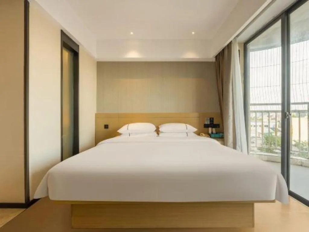 Bed in City Comfort Inn Liuzhou Wuxing Walking Street Zhonghuan Tower