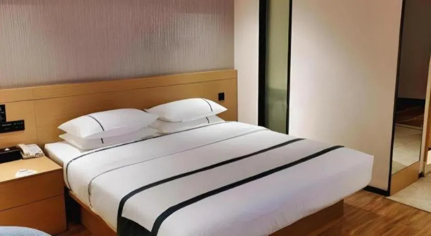 Bed in City Comfort Inn Liuzhou Wuxing Walking Street Zhonghuan Tower