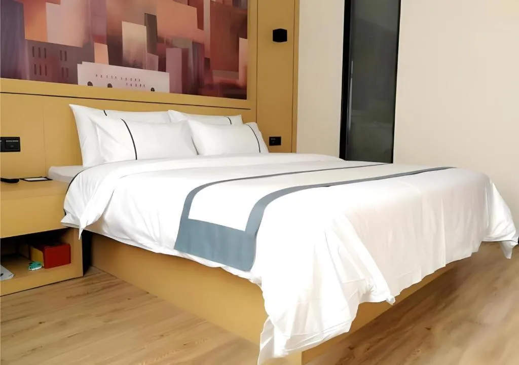 Bed in City Comfort Inn Hezhou Huangyao Ancient Town