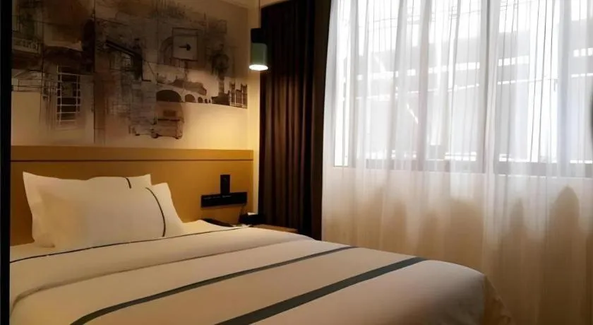 Bed in City Comfort Inn Hezhou Huangyao Ancient Town