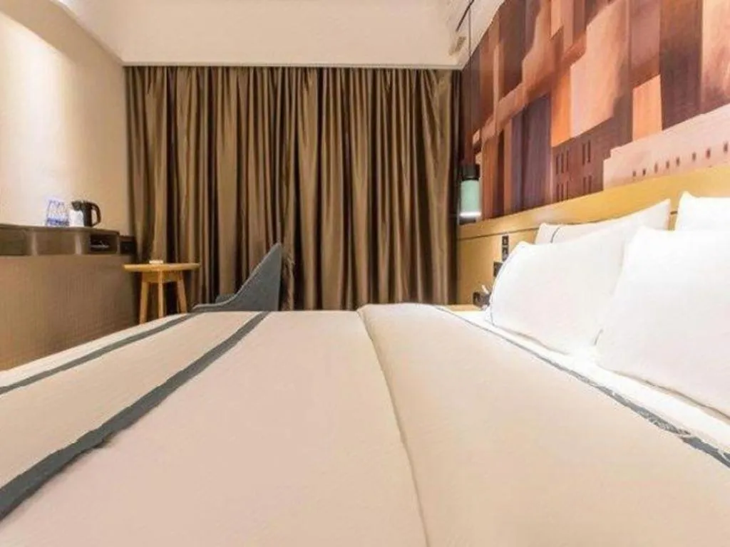 Bed in City Comfort Inn Liuzhou Chengzhong Wanda Haiguan