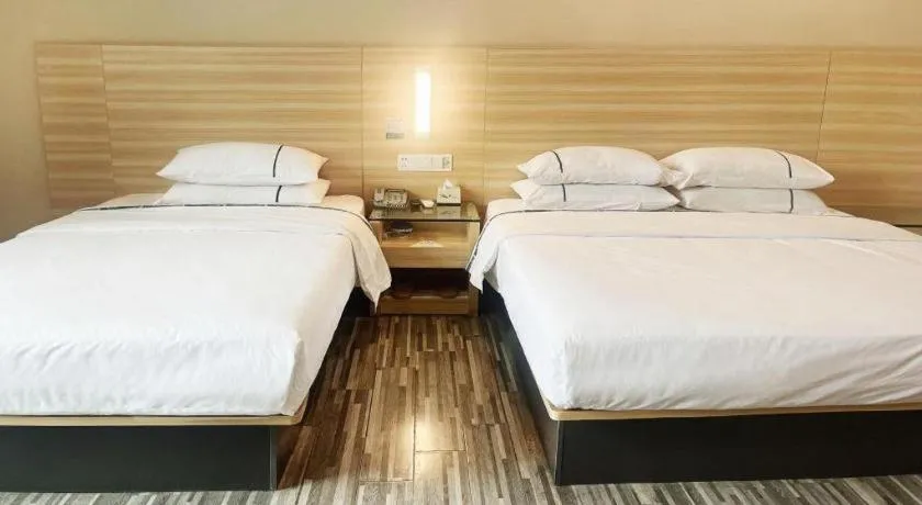 Bed in City Comfort Inn Zhongshan Dongsheng One Plus One
