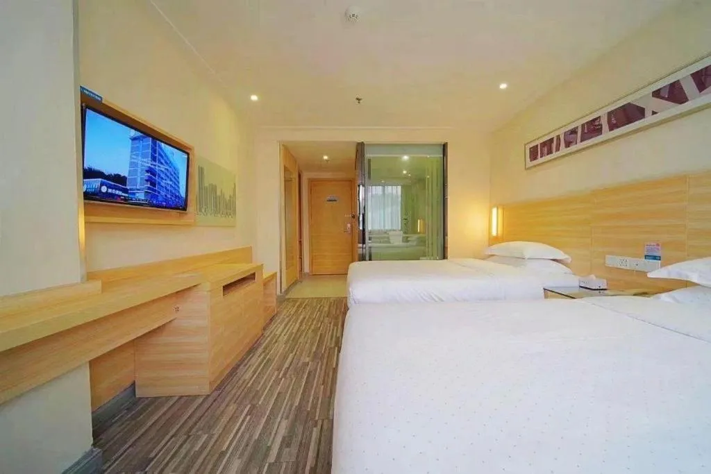 Bed in City Comfort Inn Zhongshan Dongsheng One Plus One