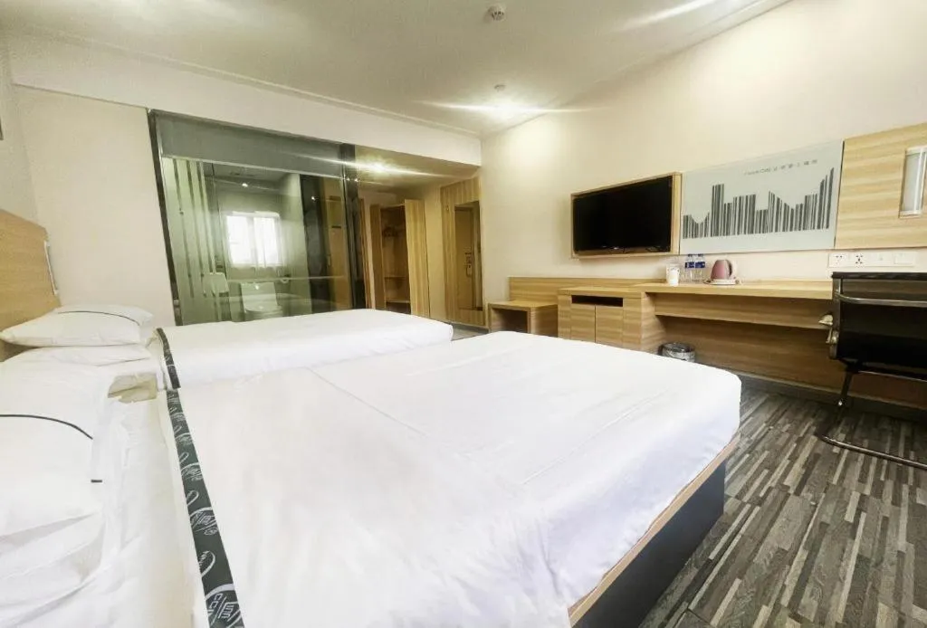 Bed in City Comfort Inn Zhongshan Dongsheng One Plus One