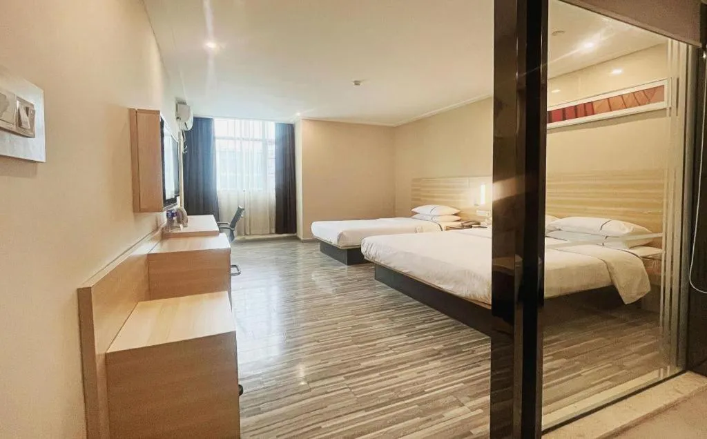 Bed in City Comfort Inn Zhongshan Dongsheng One Plus One