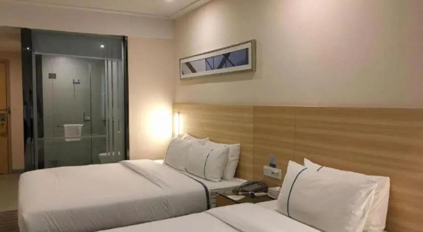 Bed in City Comfort Inn Zhongshan Dongsheng One Plus One