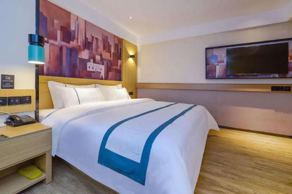 Bed in City Comfort Inn Liupanshui Sports Center