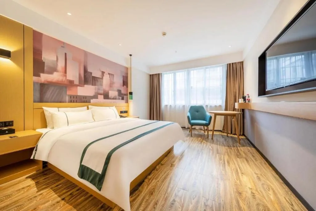 Bed in City Comfort Inn Liupanshui Sports Center