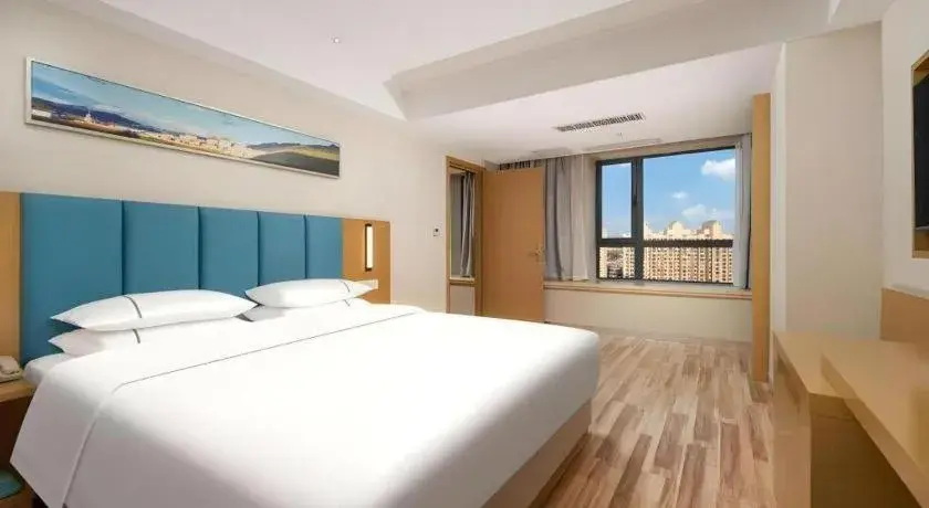 Bed in City Comfort Inn Jingzhou Wanda Plaza Bed in City Comfort Inn Jingzhou Wanda Plaza