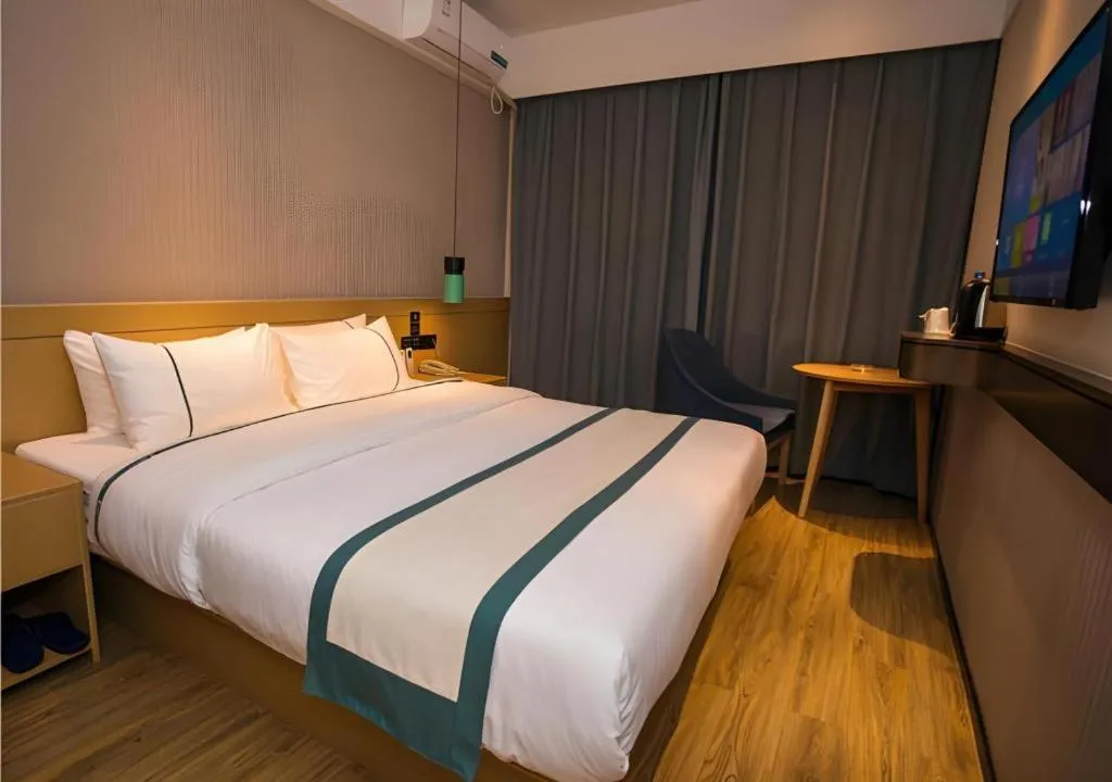 Bed in City Comfort Inn Wuhan Daxueyuan Road Qingfeng Villa