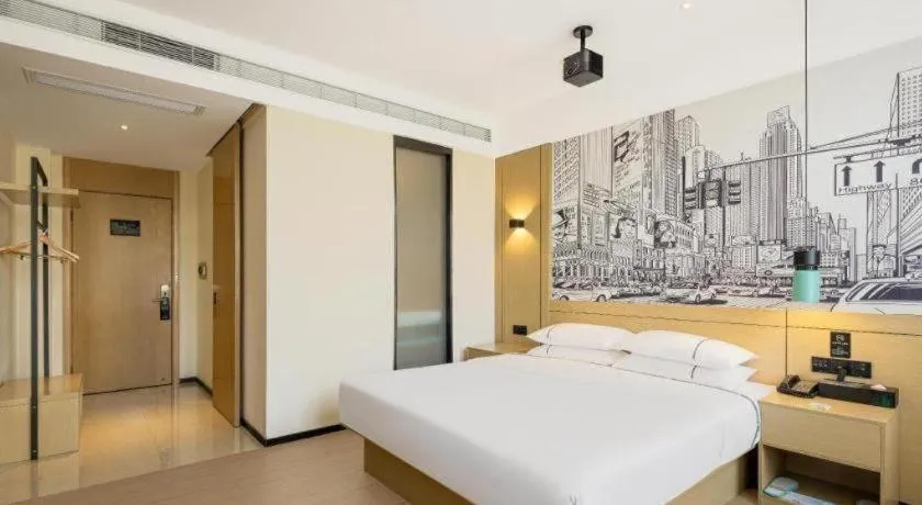 Bed in City Comfort Inn Wuhan Daxueyuan Road Qingfeng Villa