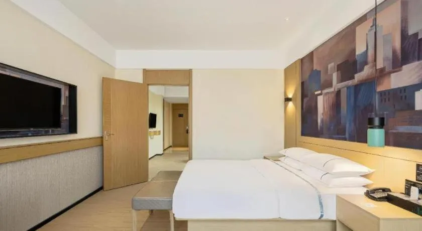 Bed in City Comfort Inn Wuhan Daxueyuan Road Qingfeng Villa