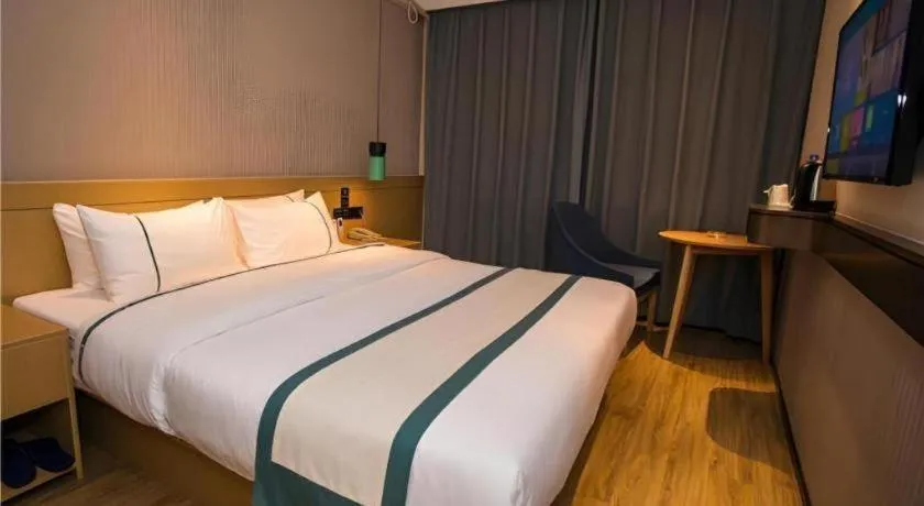 Bed in City Comfort Inn Wuhan Daxueyuan Road Qingfeng Villa