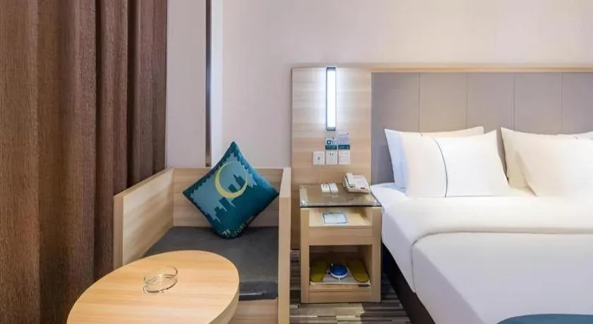 Bed in City Comfort Inn Zhongshan Xiaolan Xinduhui Gymnasium