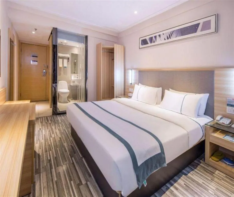 Bed in City Comfort Inn Zhongshan Xiaolan Xinduhui Gymnasium