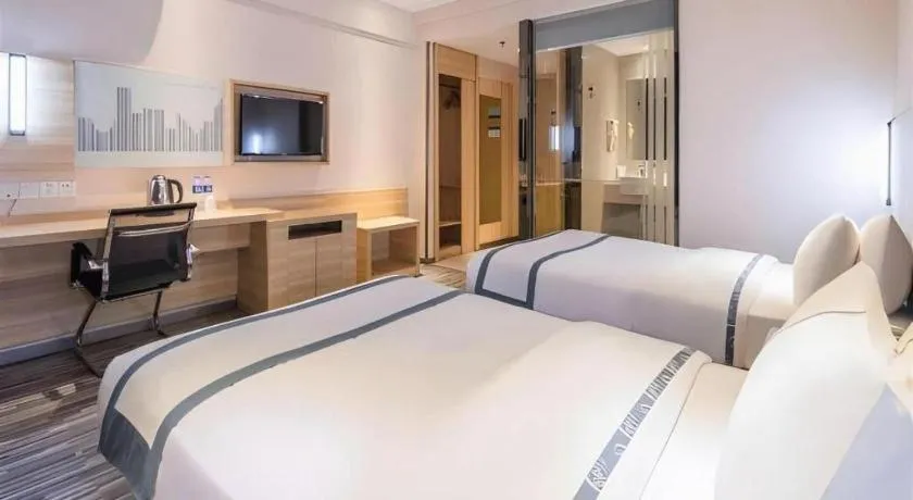 Bed in City Comfort Inn Zhongshan Xiaolan Xinduhui Gymnasium