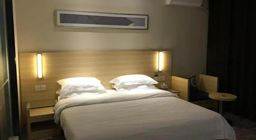 Bed in City Comfort Inn Zhongshan Xiaolan Xinduhui Gymnasium
