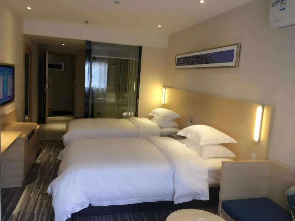 Bed in City Comfort Inn Zhongshan Xiaolan Xinduhui Gymnasium