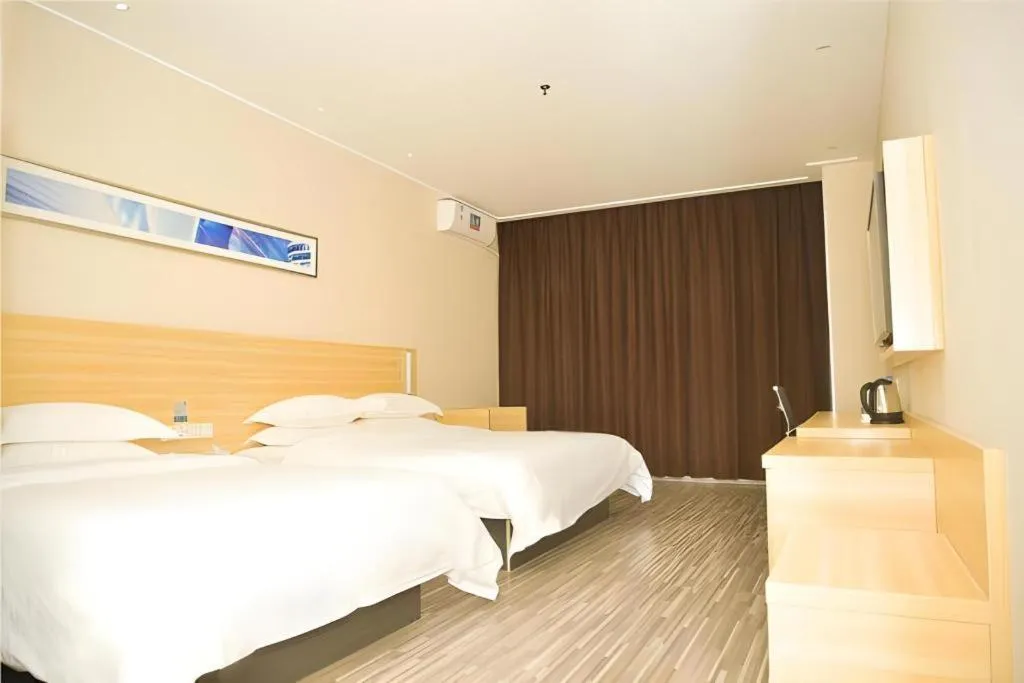 Bed in City Comfort Inn Zhongshan Xiaolan Xinduhui Gymnasium