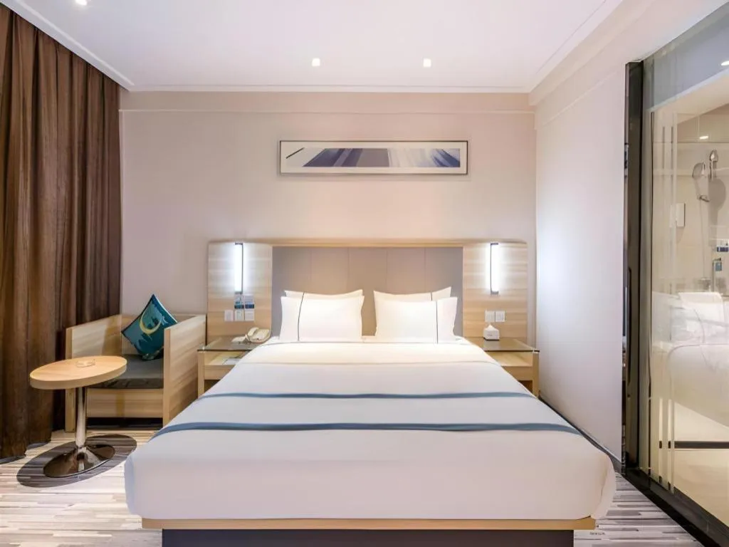 Bed in City Comfort Inn Zhongshan Xiaolan Xinduhui Gymnasium