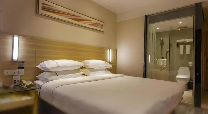 Bed in City Comfort Inn Zhongshan Xiaolan Xinduhui Gymnasium