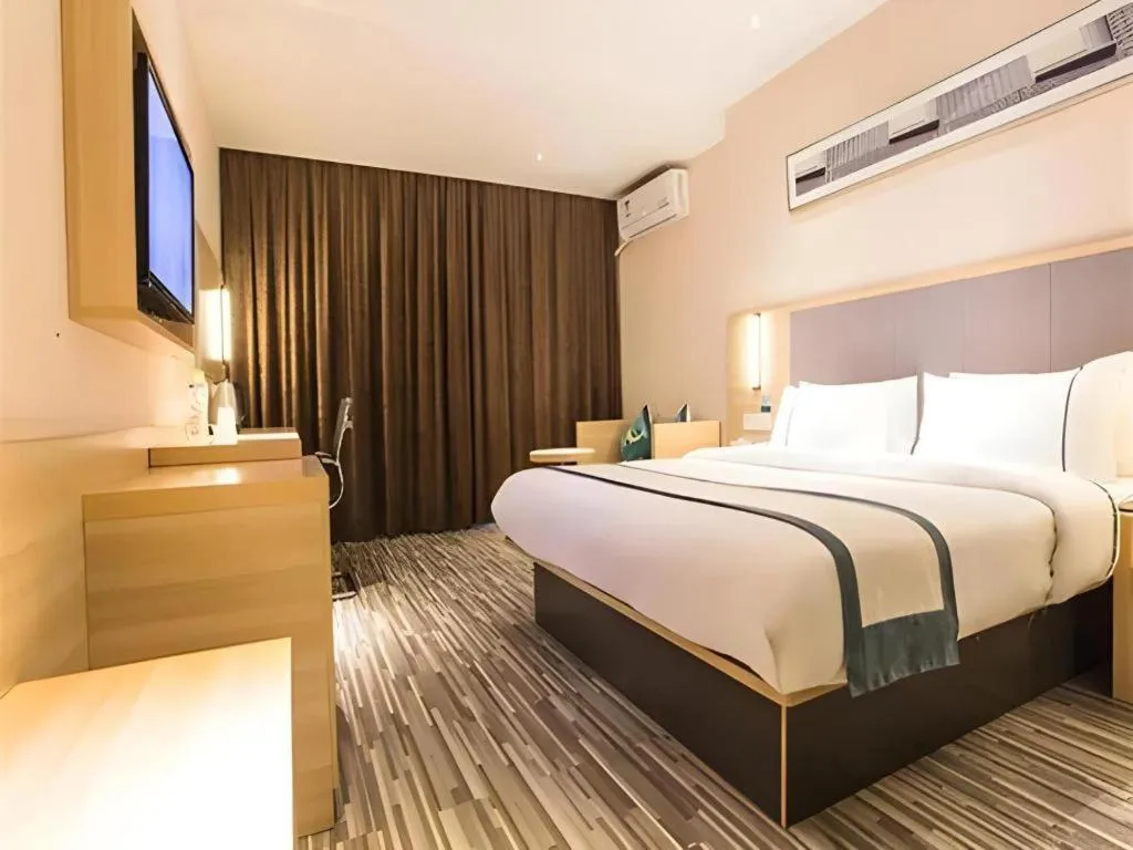 Bed in City Comfort Inn Zhongshan Xiaolan Xinduhui Gymnasium