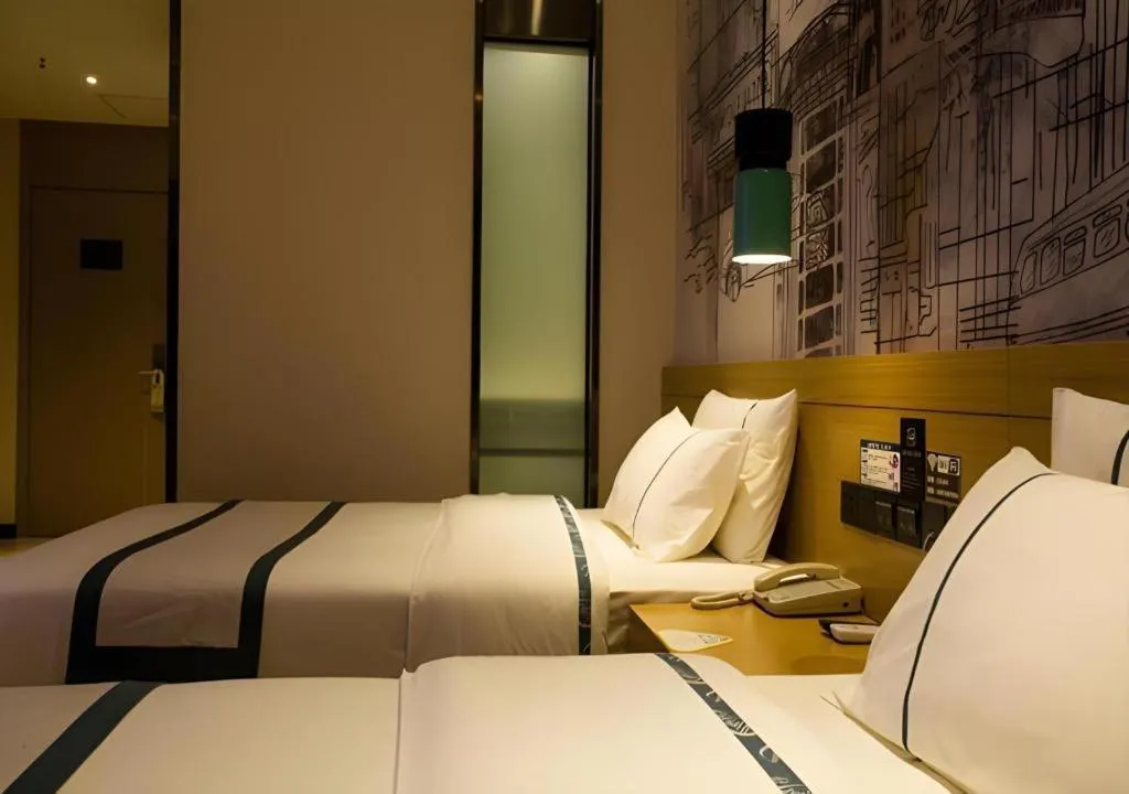 Bed in City Comfort Inn Huanggang Wuxue Bus Center