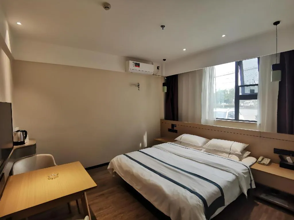 Bed in City Comfort Inn Huanggang Wuxue Bus Center