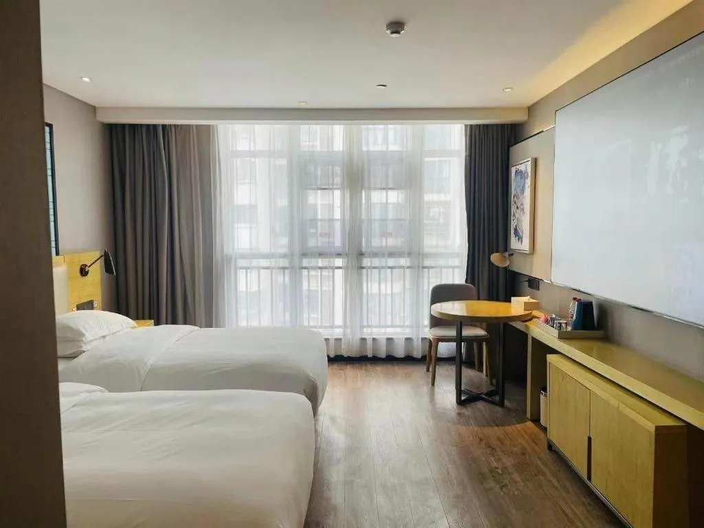 Bed in Echarm Hotel Huangshi Yingbin Avenue