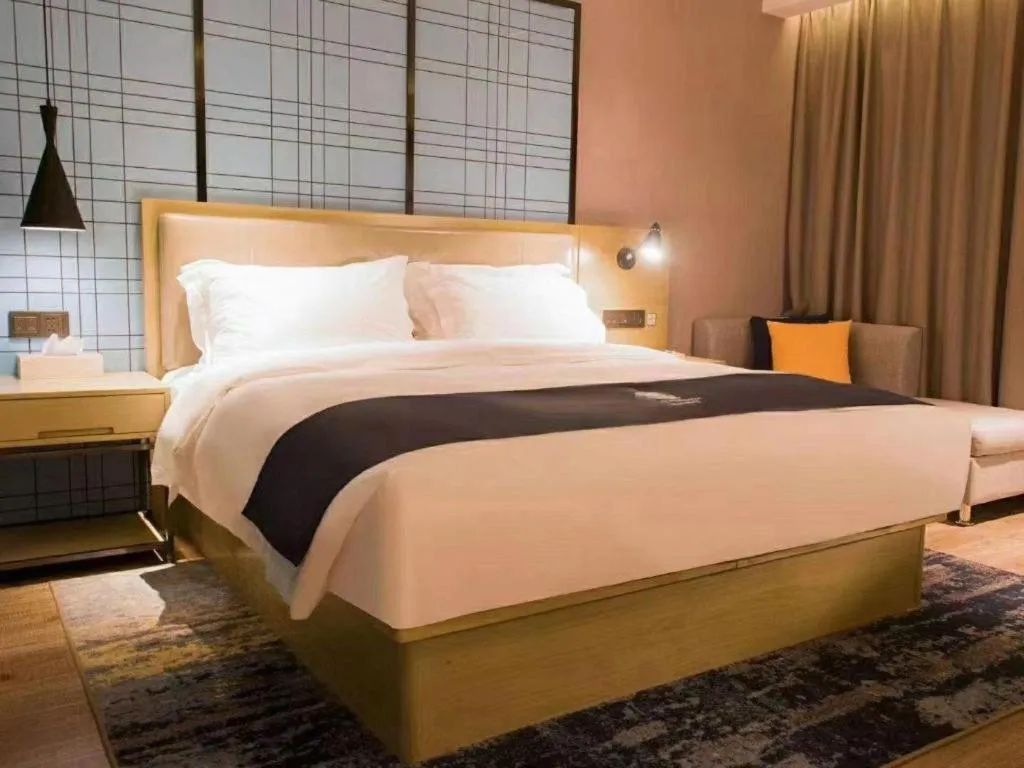 Bed in Echarm Hotel Huangshi Yingbin Avenue