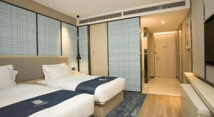 Bed in Echarm Hotel Changchun Jiutai District Government Railway Station