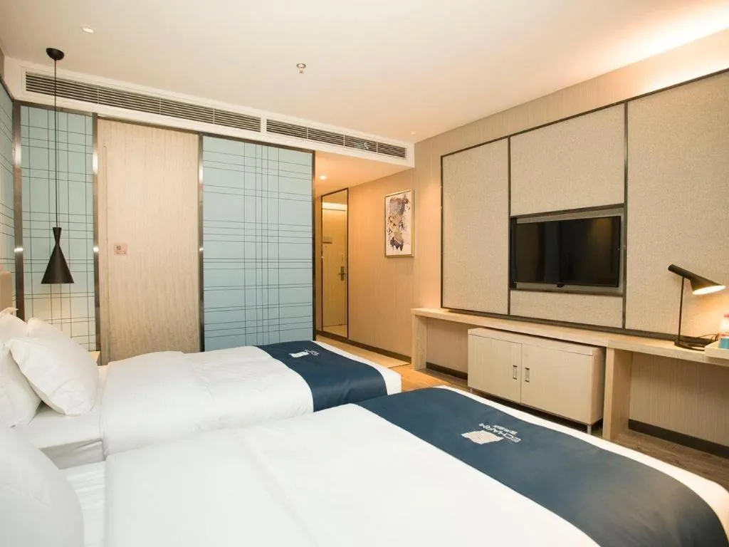 Bed in Echarm Hotel Changchun Jiutai District Government Railway Station