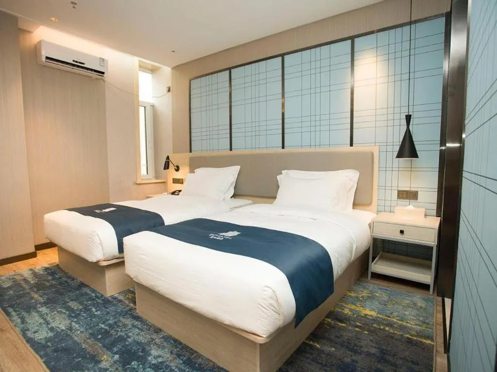 Bed in Echarm Hotel Changchun Jiutai District Government Railway Station