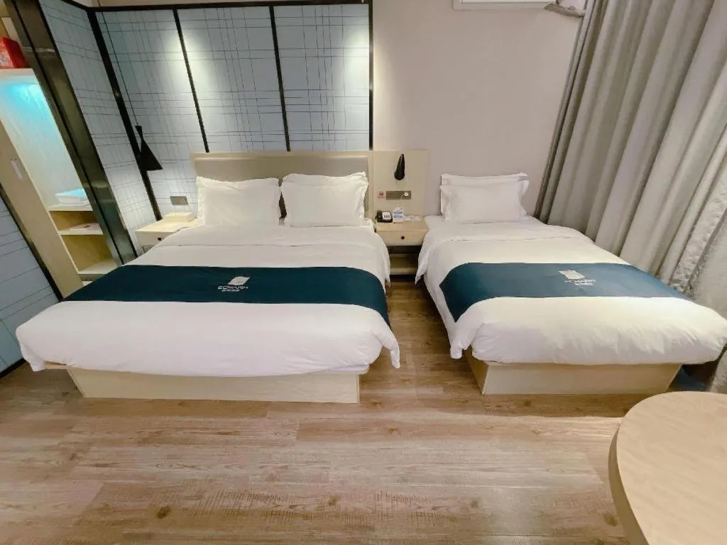 Bed in Echarm Hotel Changchun Jiutai District Government Railway Station