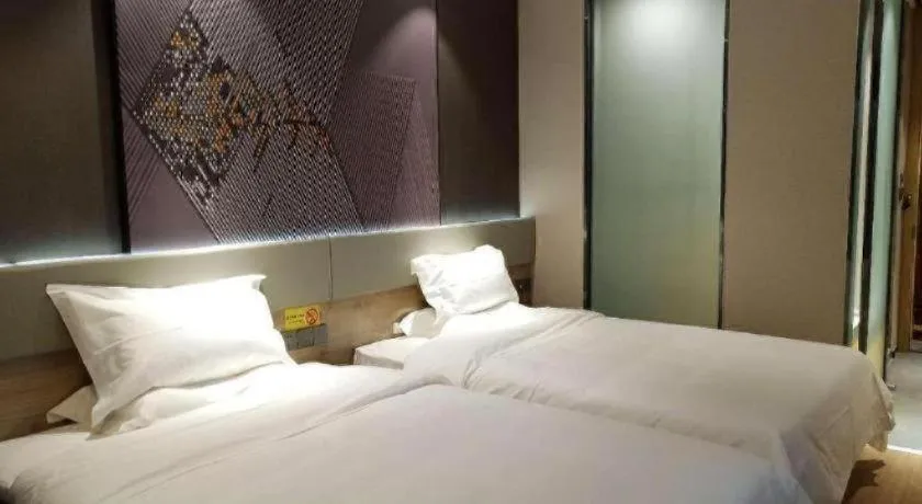 Bed in IU Hotels· Tianjin Houtai Chengjian University Haitai Industrial Park
