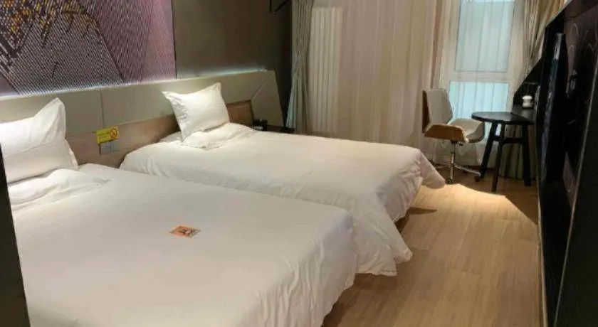 Bed in IU Hotels· Tianjin Houtai Chengjian University Haitai Industrial Park