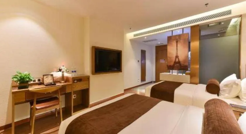 Bed in James Joyce Coffetel Shijiazhuang the Mixc Jinyuan Tower Airport Bus